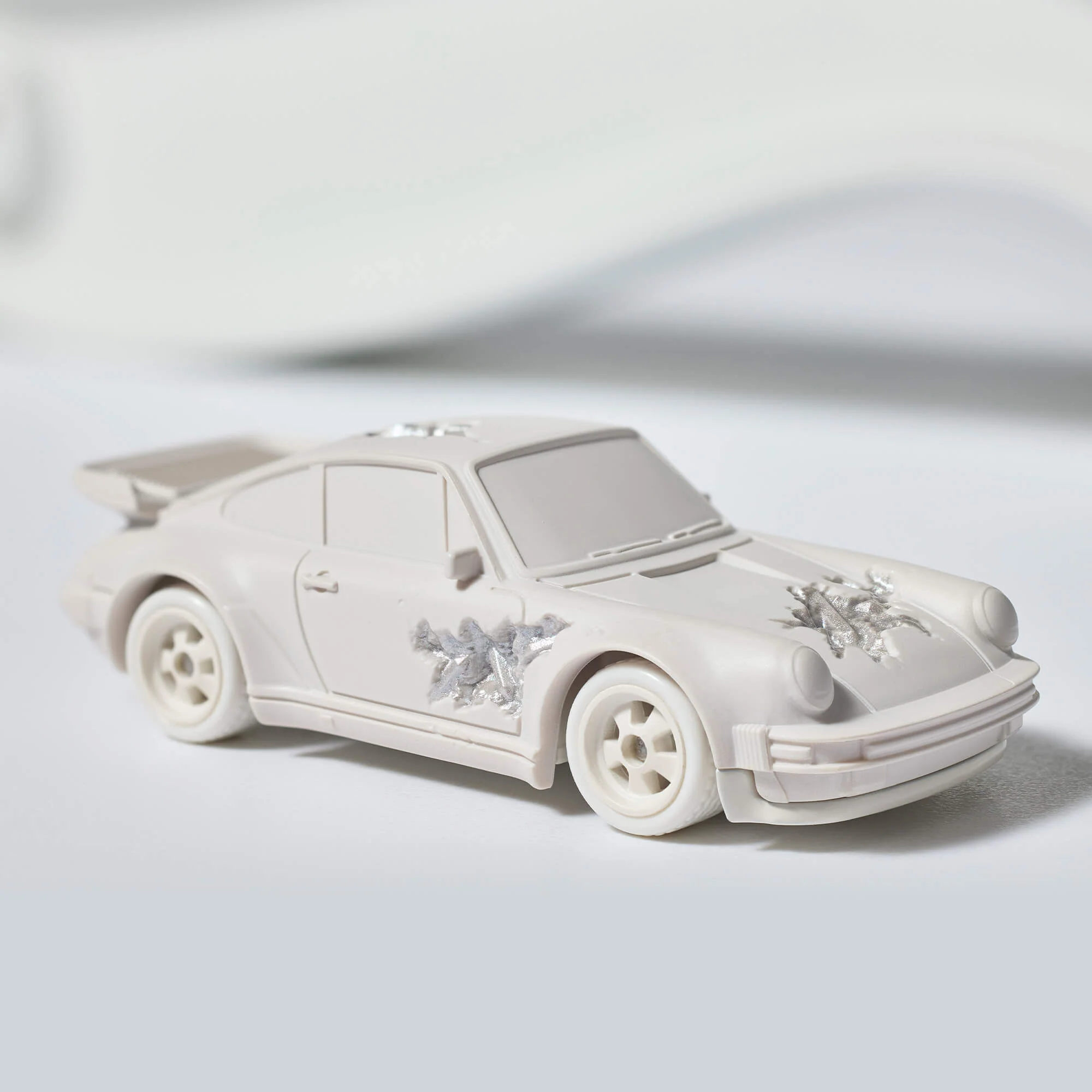 Mattel Creations Hot Wheels x Daniel Arsham Eroded Porsche 930 and Rally Case